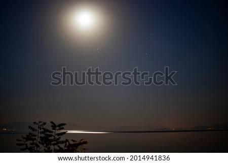 Moon and Yakamoz on Lake Van. low aperture long exposure photography.