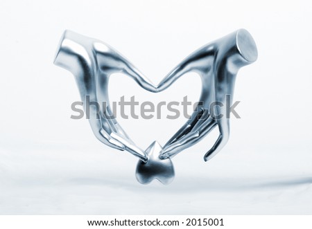 metallic hands holding steal heart