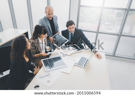 Solar panel green or renewable energy business concept, Group of business people meeting on solar cell panel technology and planning together Royalty-Free Stock Photo #2015006594