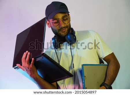 h happy student with laptop and books