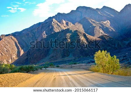 Sandy road leading to Mountains in Namibia, Southern Africa Royalty-Free Stock Photo #2015066117