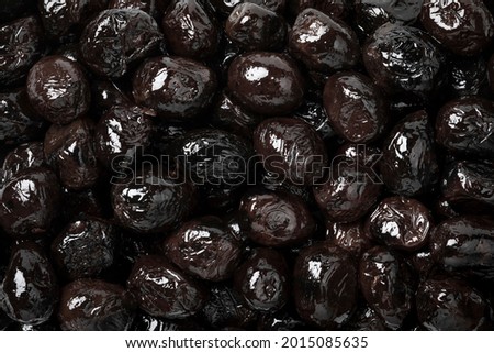 Preserved Moroccan black breakfast olives close up full frame as a background Royalty-Free Stock Photo #2015085635