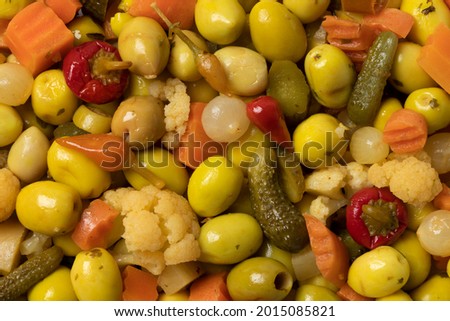 Mixture of preserved olives and vegetables close up full frame for a snack Royalty-Free Stock Photo #2015085821