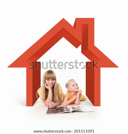 Happy young family with children in house