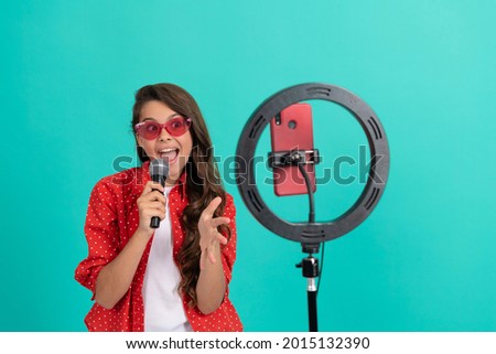 vocal tutorial lesson online. happy teenage girl singer use selfie led. kid music blogger. Royalty-Free Stock Photo #2015132390
