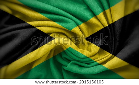 The national flag of Jamaica. Jamaica flag with fabric texture. Close up waving flag of Jamaica.