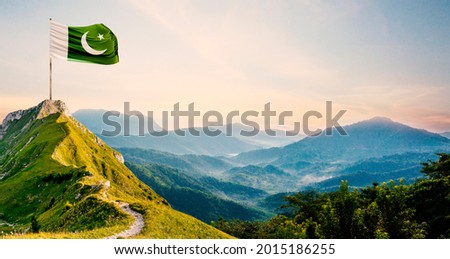Pakistan flag on a background of mountain valley Royalty-Free Stock Photo #2015186255