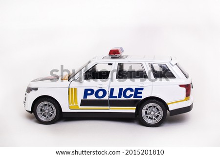 Police toy car on a white background close up