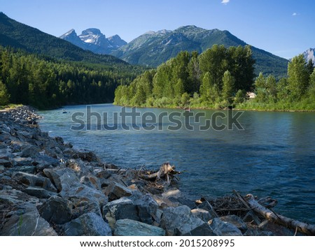 River with mountain range in the background, East Kootenay, British Columbia, Canada Royalty-Free Stock Photo #2015208995