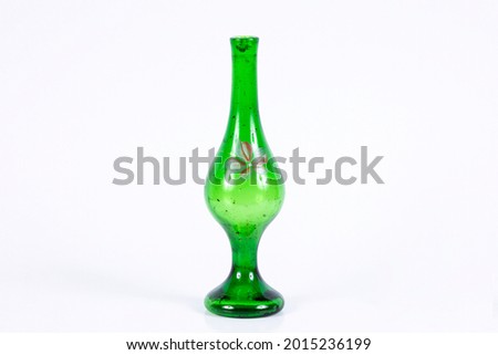 Vintage wonderful interesting different background image made of retro green bottle vase composition on white backdrop buying
