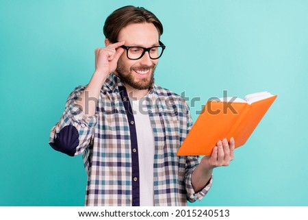 Profile side photo of young man happy positive smile read book materials education isolated over teal color background