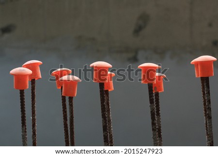 Protection of dangerous from spikes steel rods or boring pile after cutting by protective in construction site.