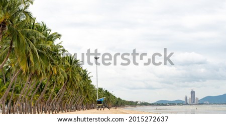 tropical and aloha summer vacation background photo of sea, beach, the coconut tree and cloudy blue sky. Concept for use as graphical element summer vacation background