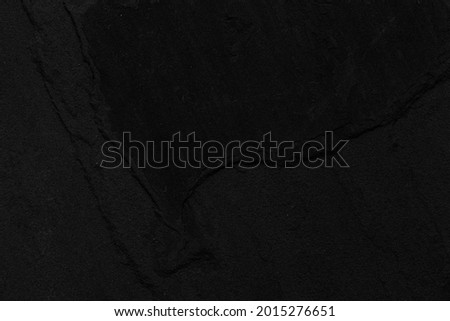 Dark grey black slate background or texture. Black granite slabs background
