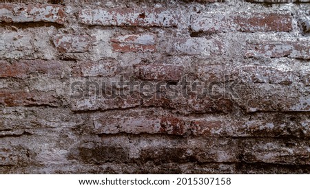 an outdated brick wall, can be used as a rustic or ethnic photo background