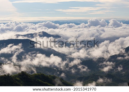 Sea of fog flow over mountain on the morning.