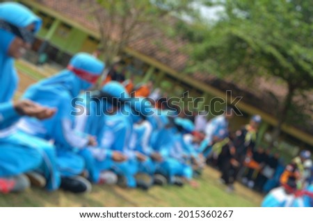 Blur photo with schoolchildren playing outside school