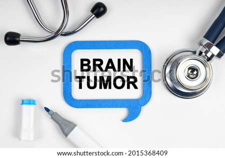 Medicine concept. On the table is a stethoscope, a marker and a sign with the inscription - Brain Tumor