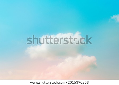 Pastel pink blue gradient sky with clouds background
