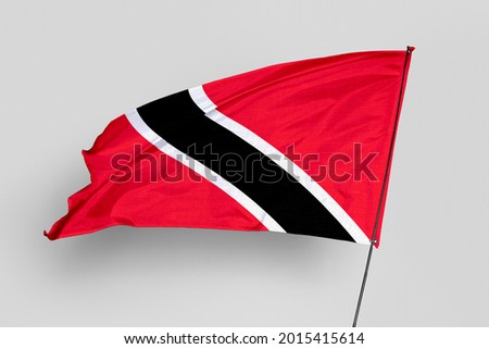 Trinidad and Tobago flag isolated on white background. National symbol of Trinidad and Tobago. Close up waving flag with clipping path.