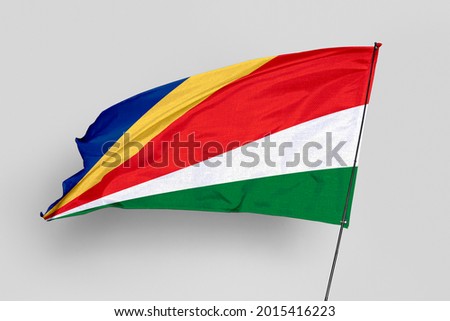 Seychelles flag isolated on white background. National symbol of Seychelles. Close up waving flag with clipping path.