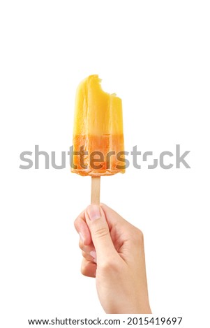Woman holds bitten yellow ice cream on white background isolated. Color frozen fruit popsicle. Royalty-Free Stock Photo #2015419697