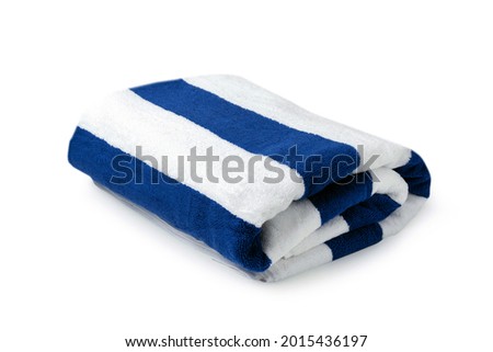Blue stripes beach towel folded isolated on white background, Summer vacation concept in Hotel Royalty-Free Stock Photo #2015436197
