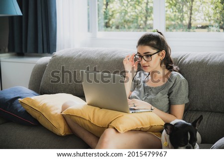 young woman talking with video conference at home, online remote communication technology to call by laptop computer on cyberspace, lifestyle of female person happy to work and keep distant isolated