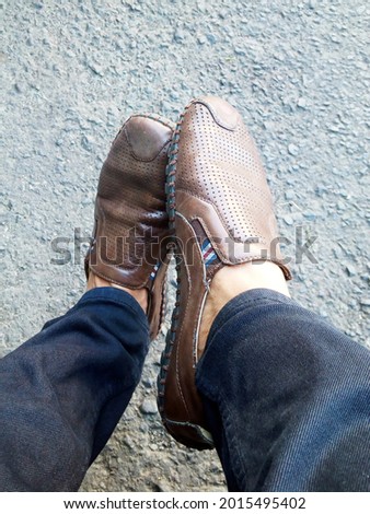 unique brown shoes with black pants photo