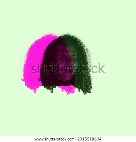 Scared, fear. Close-up young woman's face, head with colored silhouette, shadow isolated on light background. Facial expression, human emotion, split personality, mental problems concept.