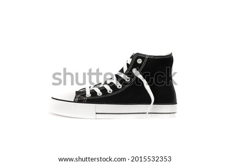 Photo of black sneakers on a white background. Modern. Classic style