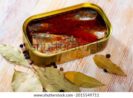 Open tin can of spicy sardines in aluminium can. High quality photo