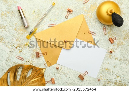Composition with blank card and envelope on light background