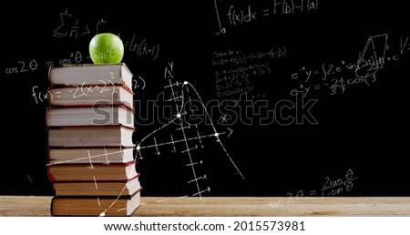 Image of mathematical equations floating over books and apple on black background. Education back to school concept digitally generated image.
