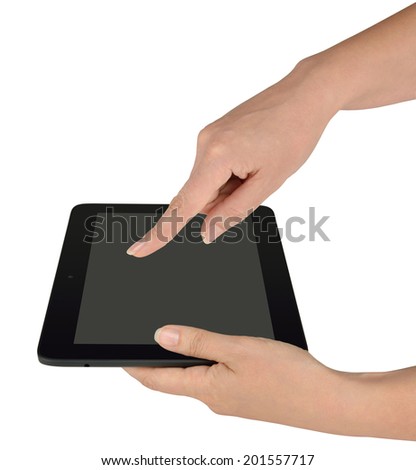 Woman using her pad, one hand holding a black tablet computer, the other touching its screen with forefinger. Side view, isolated on white background, with clipping paths.