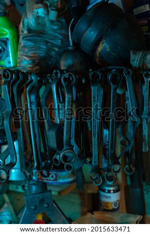 A lot of old box wrench in vintage dirty garage. High quality photo