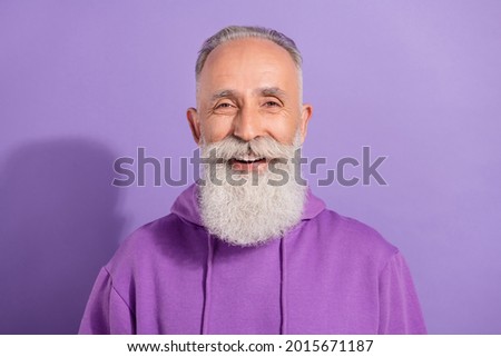 Portrait of attractive glad cheerful grey-haired man good mood isolated over purple violet color background
