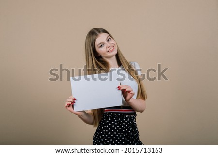 Young beautiful woman hold white banner, an isolated portrait.