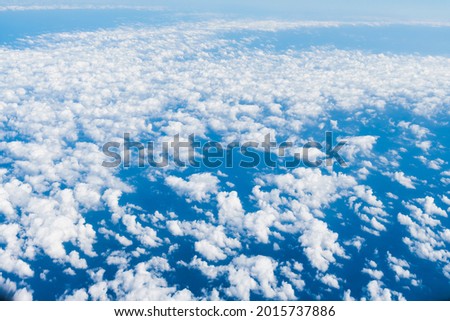 View of blue sky and white clouds during the flight