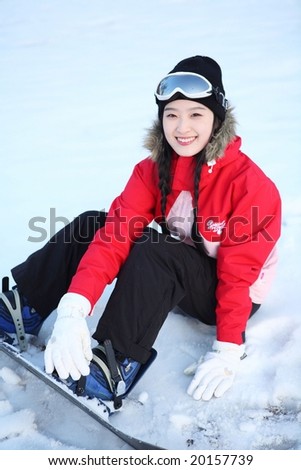 Young Ski Woman in Winter