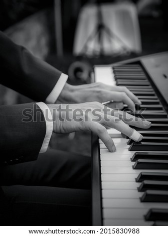 Man playing piano during wedding 