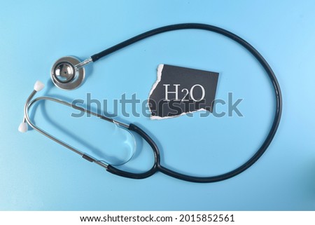 Top view image of Stethoscope with H2O or water wording. Healthy concept