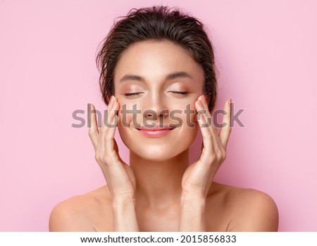 Beautiful woman with perfect skin on pink background. Beauty and skin care concept