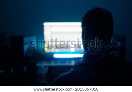 Sound producer working in recording studio.