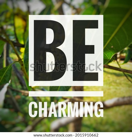 " BE CHARMING " isolated on green nature landscape.