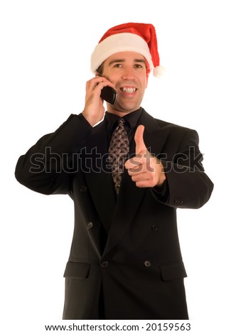 Businessman giving the thumbs up sign while talking on a cell phone