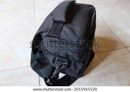 This is a picture of black bag with unique design. This bag is suitable for student to school or for traveller. 