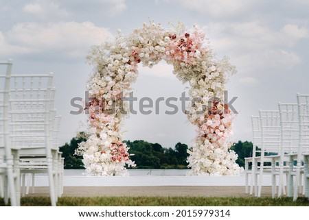 Wedding ceremony on the street on the green lawn.Decoration of a wedding celebration. Royalty-Free Stock Photo #2015979314
