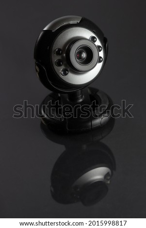A webcam for a computer on a gray background.