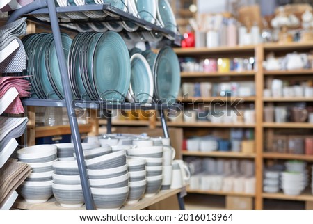 Various ceramic plates for sale in tableware department of home furnishings store.. Royalty-Free Stock Photo #2016013964